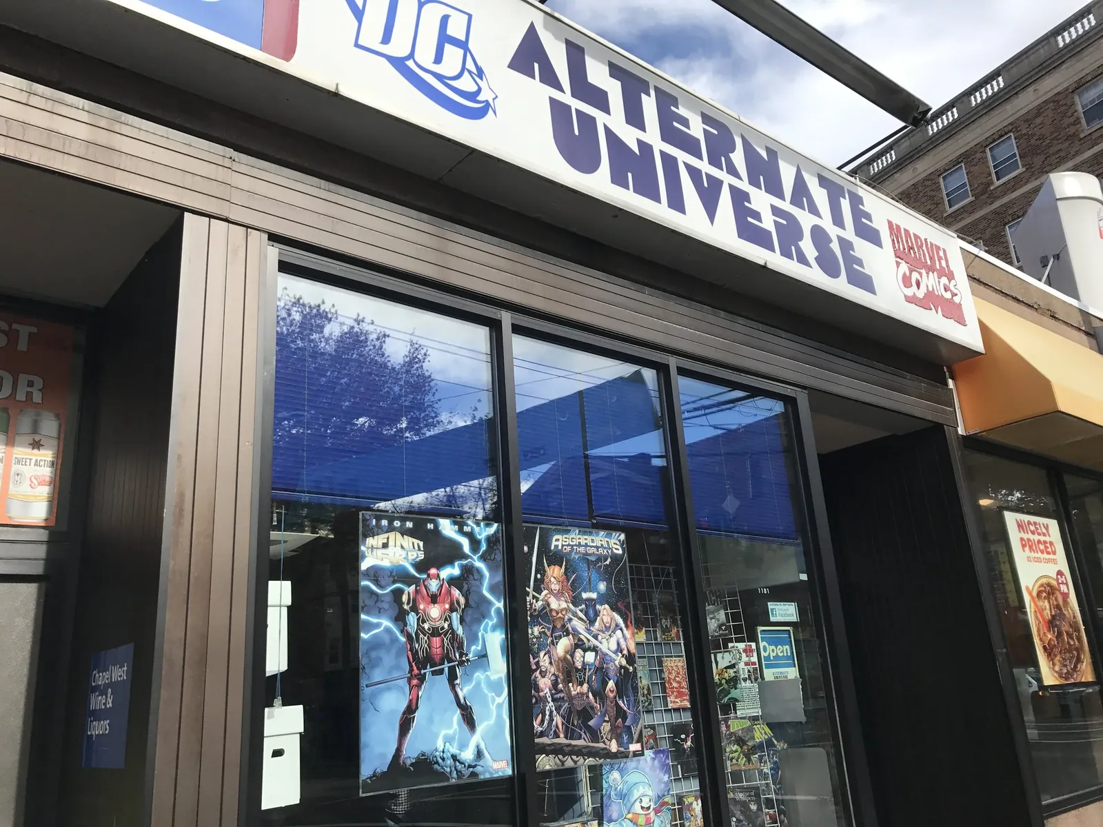 Alternate Universe's storefront, comic and film posters filling the windows