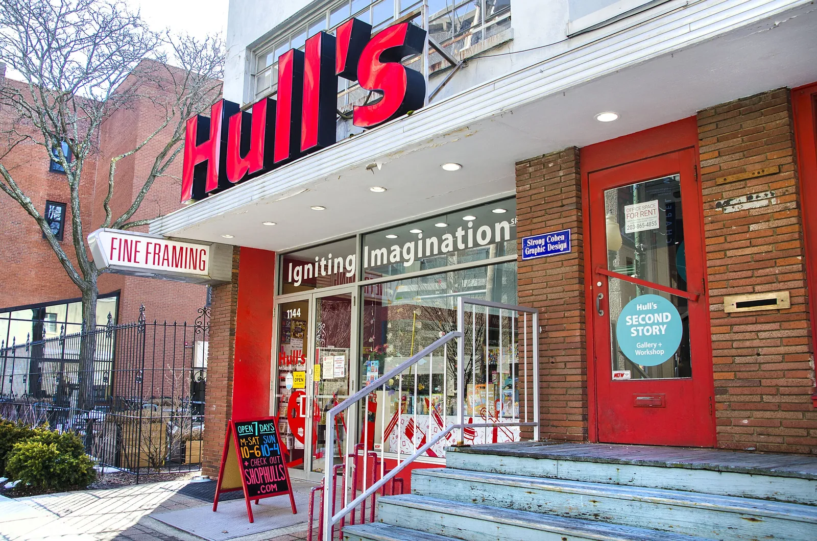 Hull's on Chapel Street, its name in tall red letters above a Fine Framing sign and a red entrance door